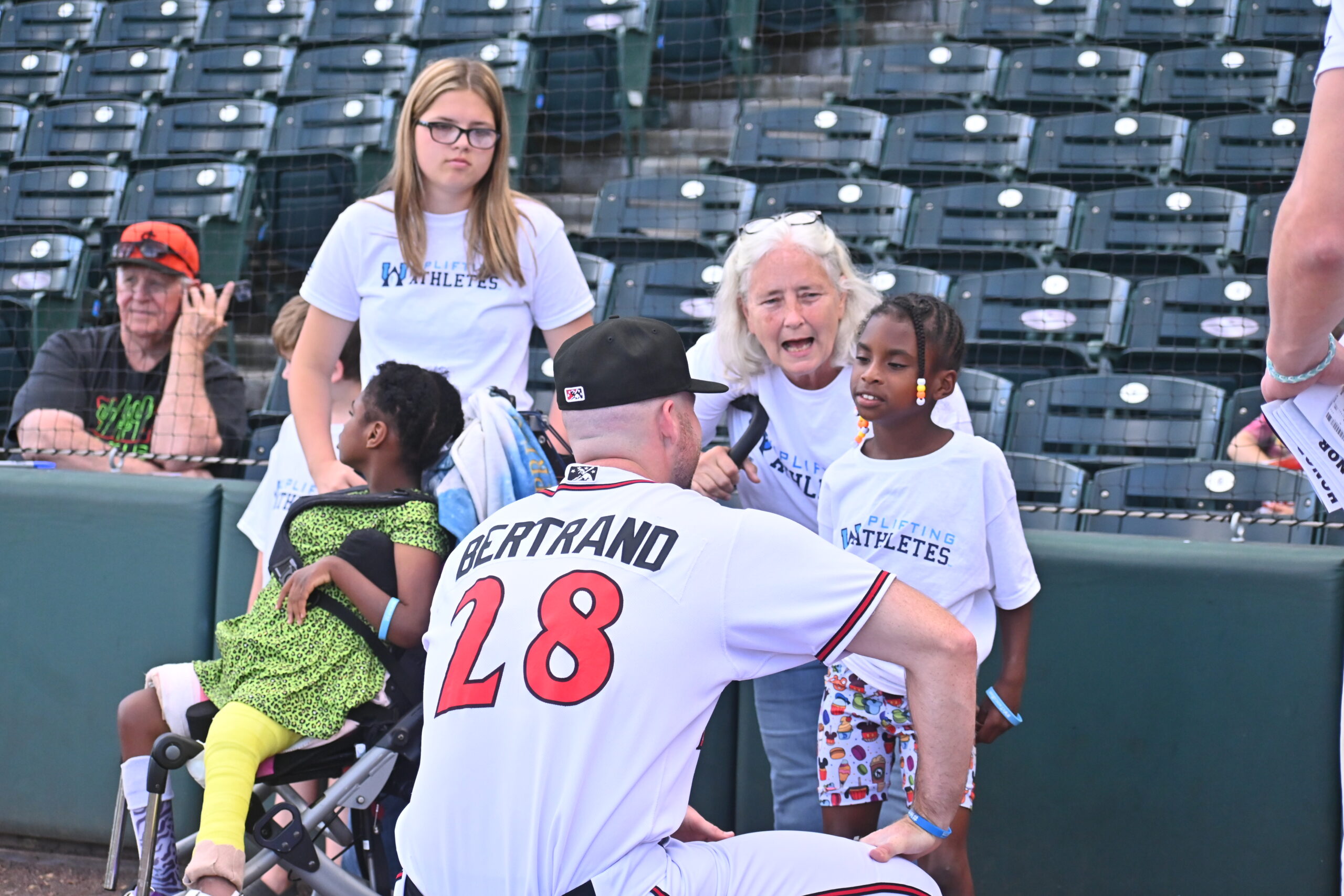 Pitcher John Michael Bertrand with a family at an Uplifting Experience